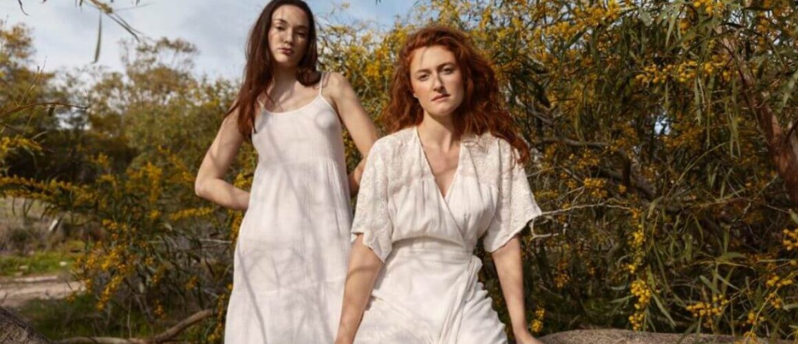 hero-image-Model-wearing-sustainable-fashion-piece-in-natural-landscape